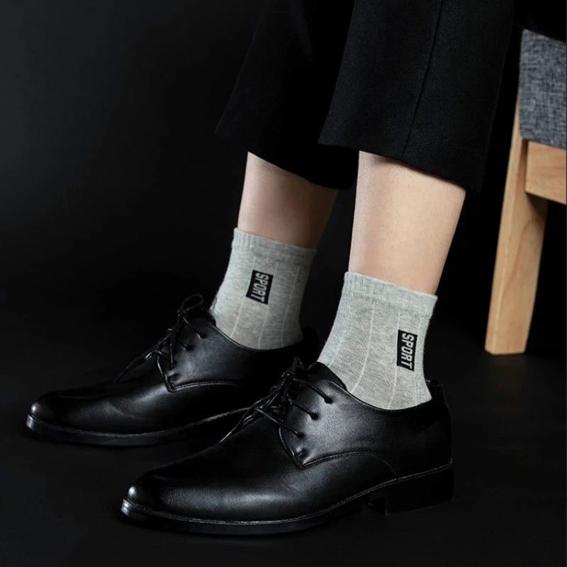 20Pcs=10Pairs High-Quality Black Cotton Socks: Breathable, sweat-absorbent, and deodorant, ideal for business attire. Perfect as a gift for any occasion.