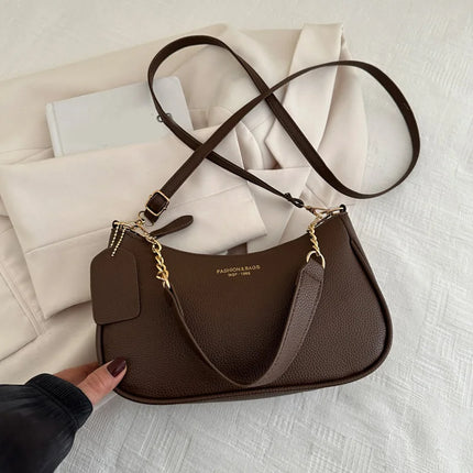 Luxury cherry pendant shoulder bag by OKEYWOW, soft lychee leather casual underarm dumpling handbag for women.