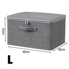 Foldable OKEYWOW large capacity clothes storage box with zipper, used as wardrobe organizer bag for clothing and accessories.
