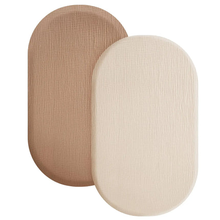 Soft breathable muslin cotton baby fitted sheet by OKEYWOW on a crib mattress showing solid color and snug fit.