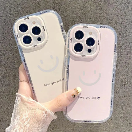 Silicone shockproof iPhone Smile Case by OKEYWOW for models 11 to 17, featuring a colorful smiley face design and soft cover texture.