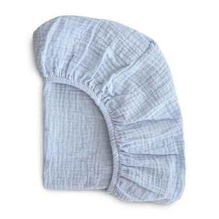 Breathable muslin cotton baby fitted sheet in solid color for crib bedding, by OKEYWOW, suitable for newborns and universal crib sizes.