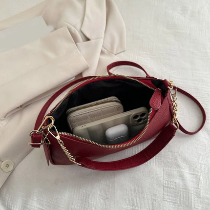 Luxury Cherry Pendant Shoulder Bag by OKEYWOW, soft lychee material, casual dumpling style, women’s underarm handbag with elegant design.