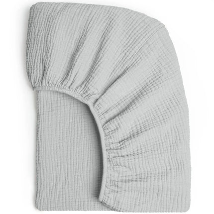 Soft, breathable muslin cotton baby fitted sheet by OKEYWOW on a crib bed, solid color, designed for newborn comfort.
