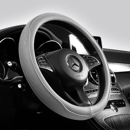 Okeywow Napa leather 15-inch perforated, non-slip breathable steering wheel cover on a car wheel, 38cm diameter.