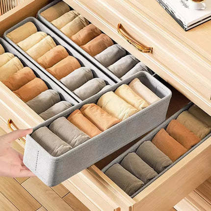 OKEYWOW drawer storage organizer box with compartments for T-shirts, jeans, underwear, and pants in a wardrobe.