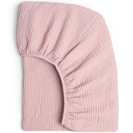 Soft, breathable muslin cotton baby fitted sheet by OKEYWOW on a crib, solid color, designed for newborns and universal crib fit.