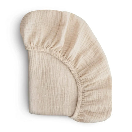 Breathable muslin cotton baby fitted sheet in solid color for crib bedding, by OKEYWOW, designed for newborns and universal crib sizes.