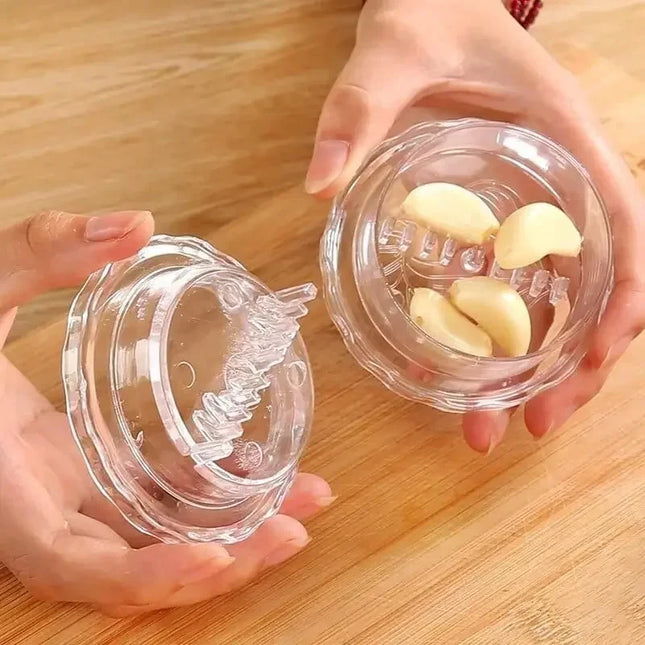OKEYWOW manual garlic press and chopper kitchen gadget for crushing garlic and chopping herbs in home kitchen.