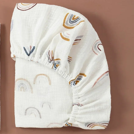 Breathable muslin cotton baby fitted sheet in solid color for crib beds, by OKEYWOW, suitable for newborns.