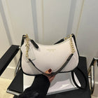 Luxury cherry pendant shoulder bag by OKEYWOW, soft lychee leather dumpling-style handbag for women with casual style.