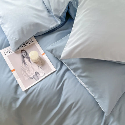 Okeywow solid color brushed fabric bedding set with duvet cover, pillowcases, bed sheet, and quilt cover in various sizes on a bed.