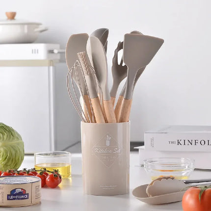 Set of 12 silicone kitchen utensils with non-stick spatulas and wooden handles from OKEYWOW for cooking and baking.