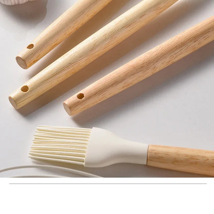 OKEYWOW 12-piece silicone kitchen utensil set with non-stick spatulas and wooden handles for cooking and baking.