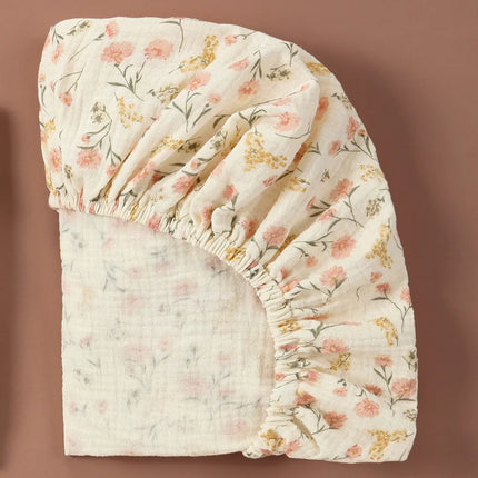 Soft, breathable muslin cotton baby fitted sheet in solid color, compatible with crib beds, by OKEYWOW.