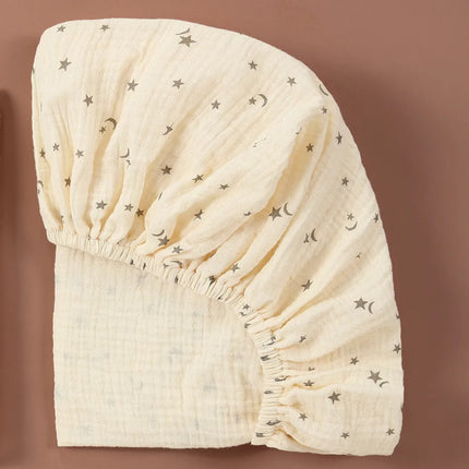 Soft, breathable muslin cotton baby fitted sheet in solid color from OKEYWOW for crib or bassinet bedding.