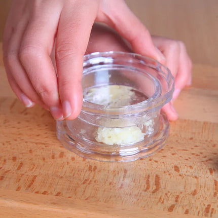 OKEYWOW manual garlic press and chopper kitchen gadget for crushing garlic and herbs, compact home appliance accessory.