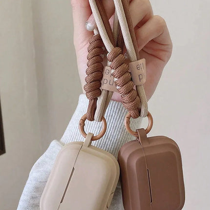 OKEYWOW silicone case with smile strap for AirPods 1/2/3/Pro/4, showing the protective cover and cheerful design.