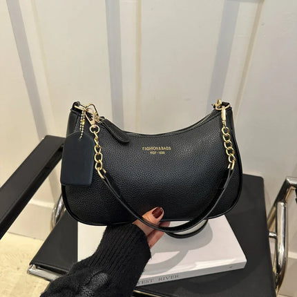 Luxury cherry pendant shoulder bag by OKEYWOW, soft lychee leather dumpling-style handbag for women with casual elegance.