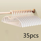 Set of OKEYWOW wide shoulder non-slip clothes hangers in various pack sizes, ideal for space-saving closet organization.