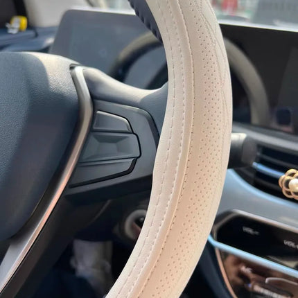 OKEYWOW Napa leather 15-inch universal steering wheel cover with perforated, breathable, non-slip design for car wheel grip.