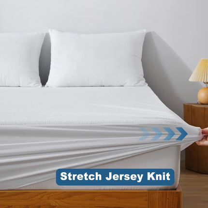 OKEYWOW waterproof terry fitted sheet mattress protector with deep pockets and breathable fabric, shown on a bed.