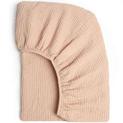 Soft, breathable muslin cotton baby fitted sheet in a solid color for crib beds, from OKEYWOW, designed for newborn comfort.