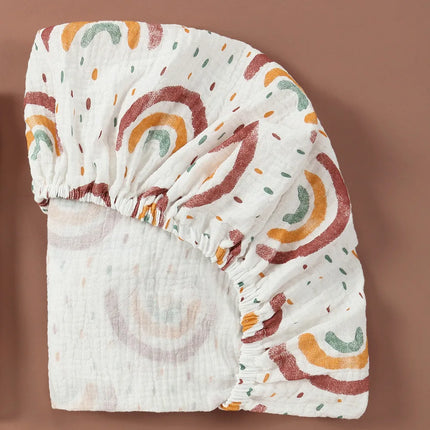Breathable muslin cotton baby fitted sheet in a solid color for crib beds, ideal for newborns from OKEYWOW.